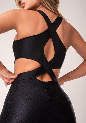 Macacão fitness feminino preto logomania cut-out com recortes flow