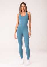 Macacão fitness feminino azul com elástico cruzado oasis